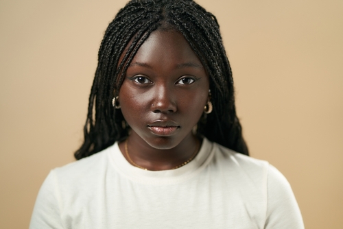 Black woman with neat long braids